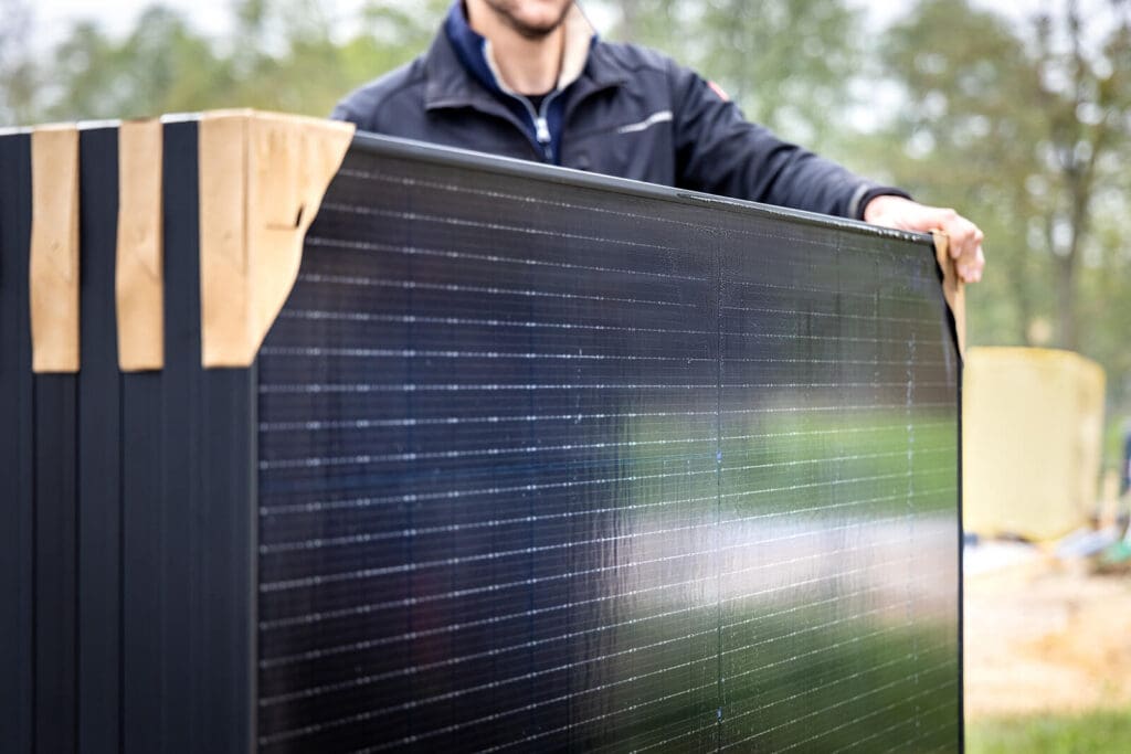 man with solar panels