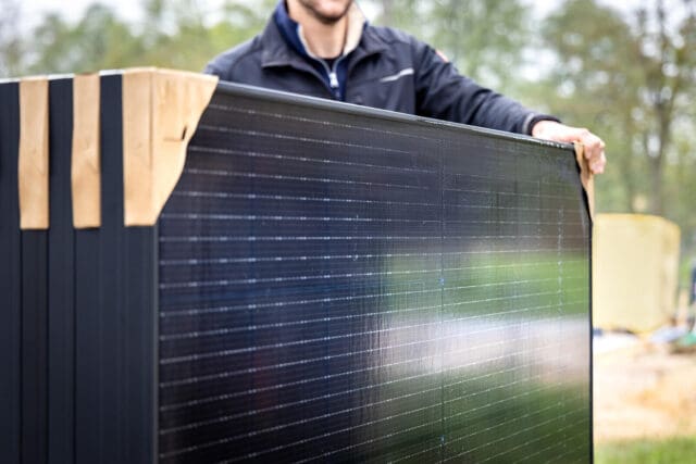 man with solar panels